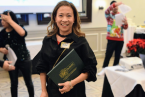 woman holding Daisy award
